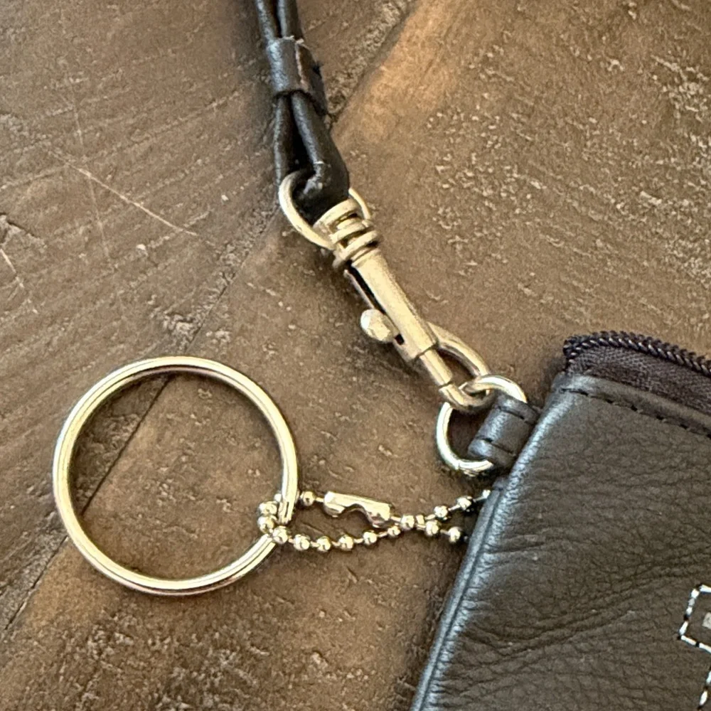 Rolfs Black Wristlet with M Monogram